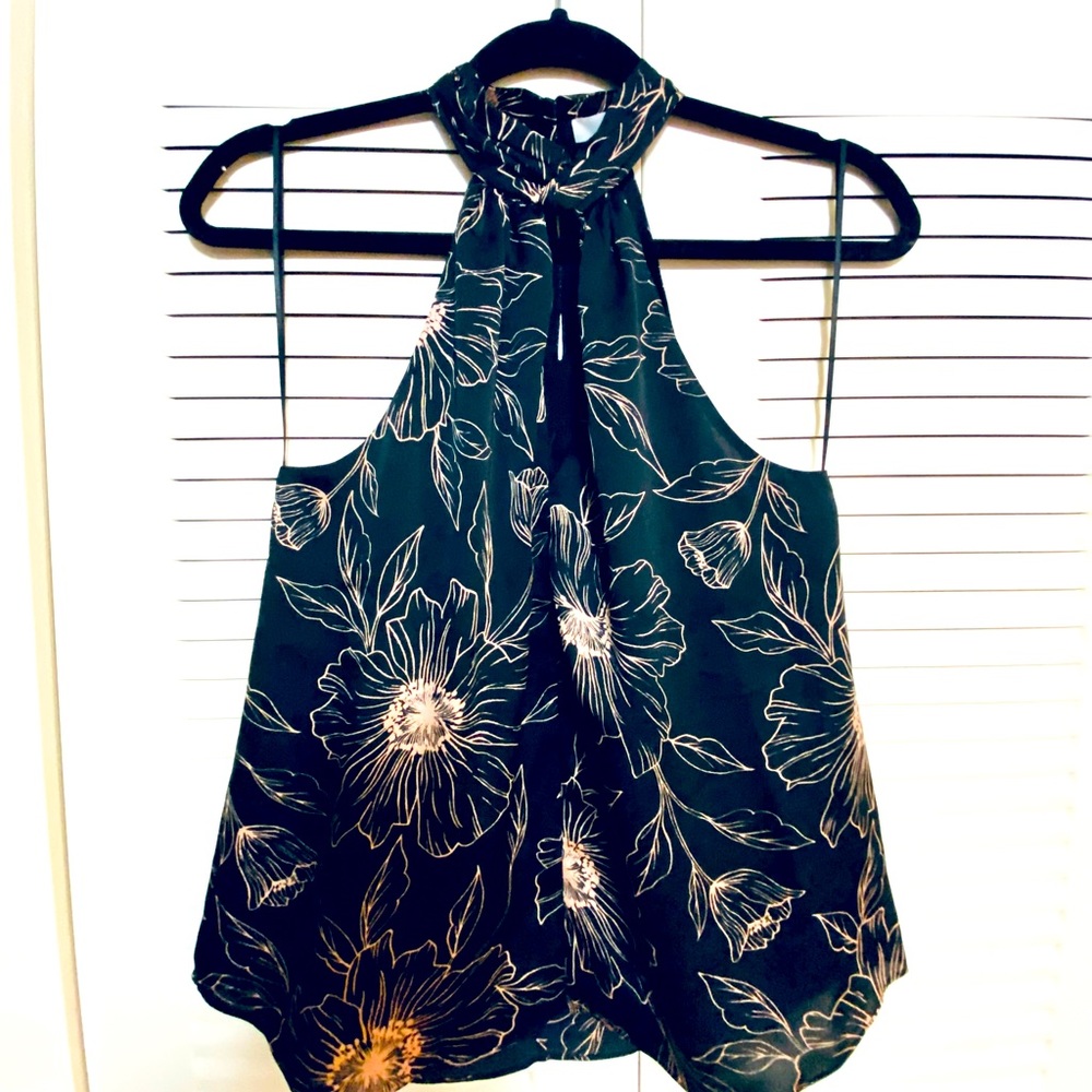 Wispy halter top by Joie. Black and crème. Flirty and fun— great condition!